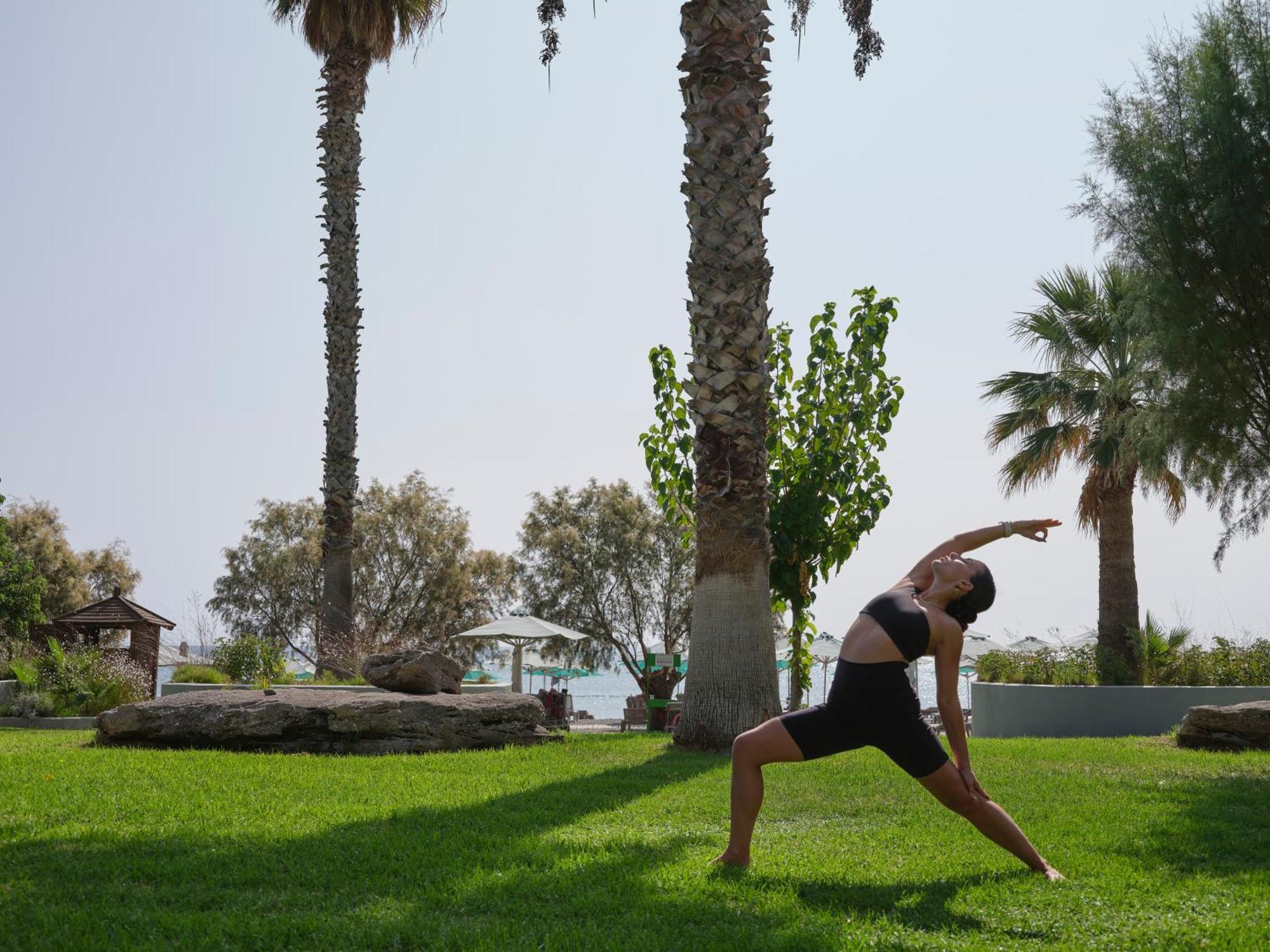 Esperos Village Blue & Spa - Adults Only Faliraki Exterior photo A woman practicing yoga